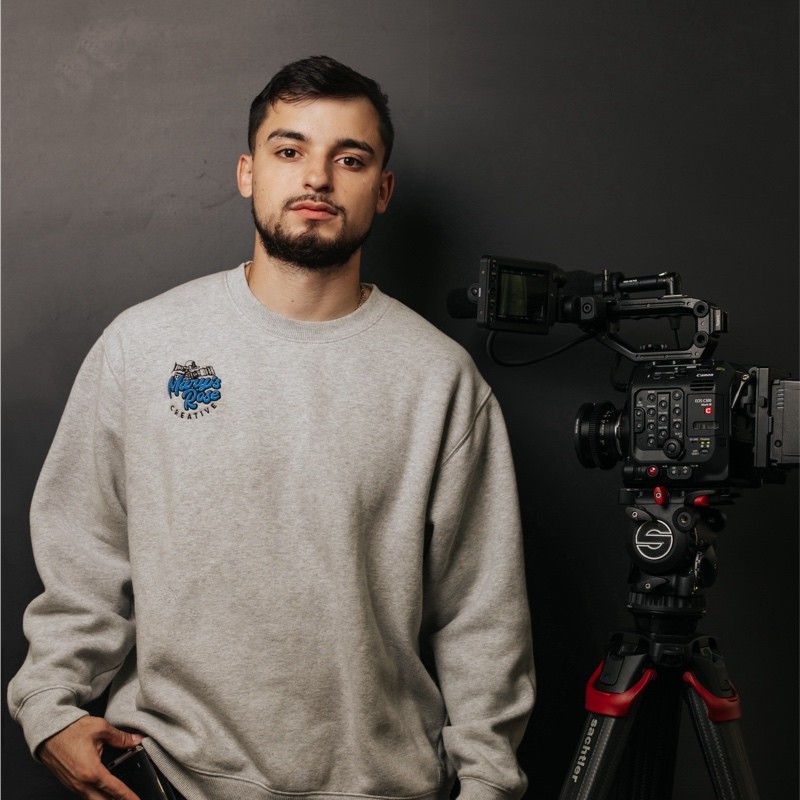 Image of AHFC's drone operator standing next to videography equipment. 