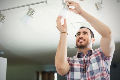 Stock Man Replacing Light Fixture