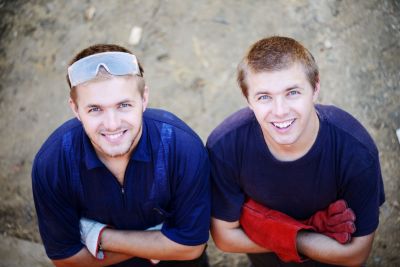 Two Male Construction Twin Workers Smiling At A Building Site SBI 300993337 RESIZED