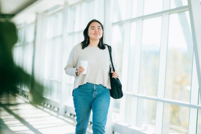 Stock Female Student Walking On Campus In Anchorage