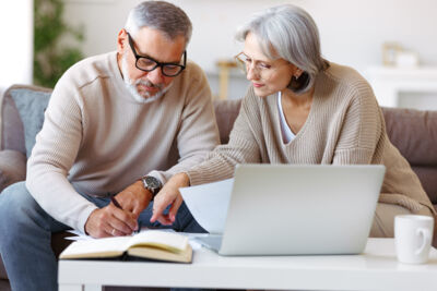 Stock Middle Aged Couple Researching Loans