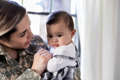 Stock Military Mom With Baby