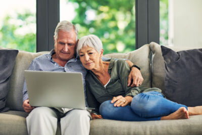 Stock Older Couple Looking At Computer