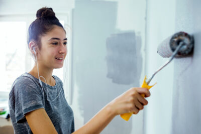 Stock Teen Painting House